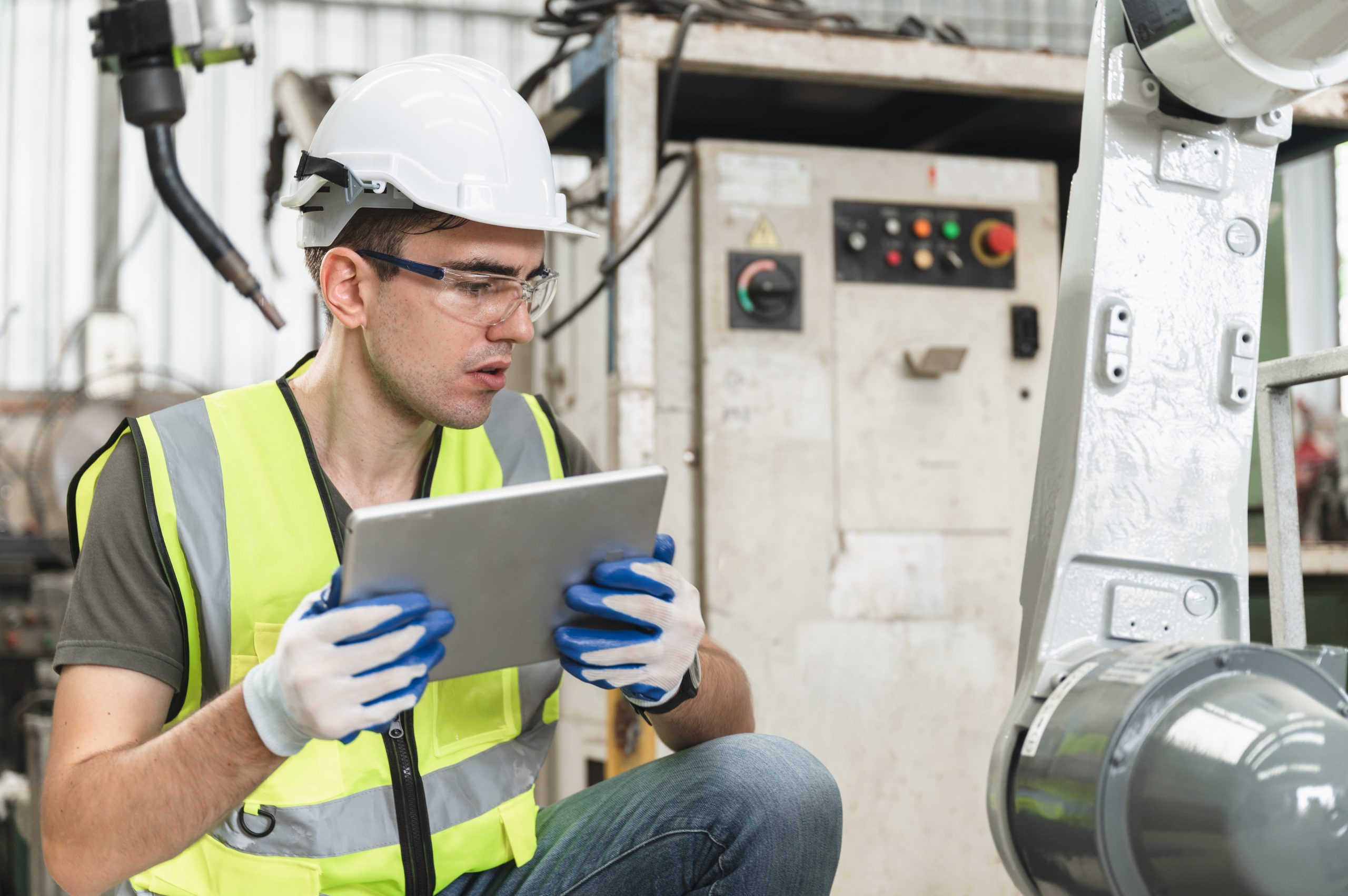 guy-with-tablet-inspecting-equipment-scaled