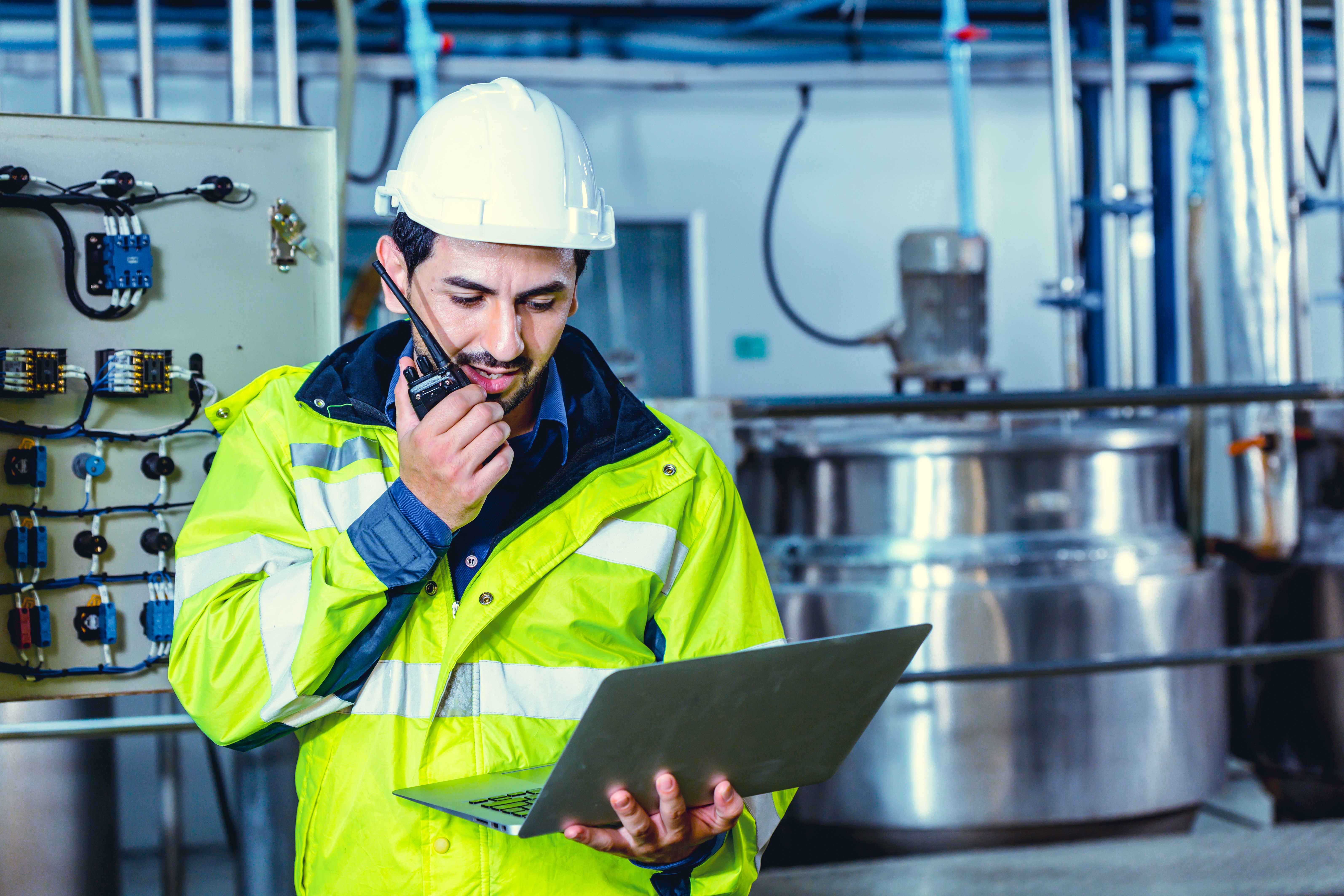 engineer worker using Walkie Talkie radio calling order working in factory