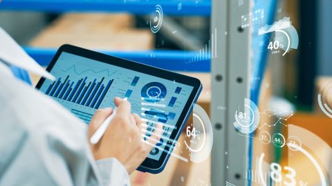 Worker using tablet PC and statistical data. Inventory control. Warehouse management systems.